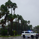 A police patrol drives around a neighborhood of St. Pete Beach as the winds from Hurricane Ian arrive on September 28, 2022 in St. Petersburg, Florida